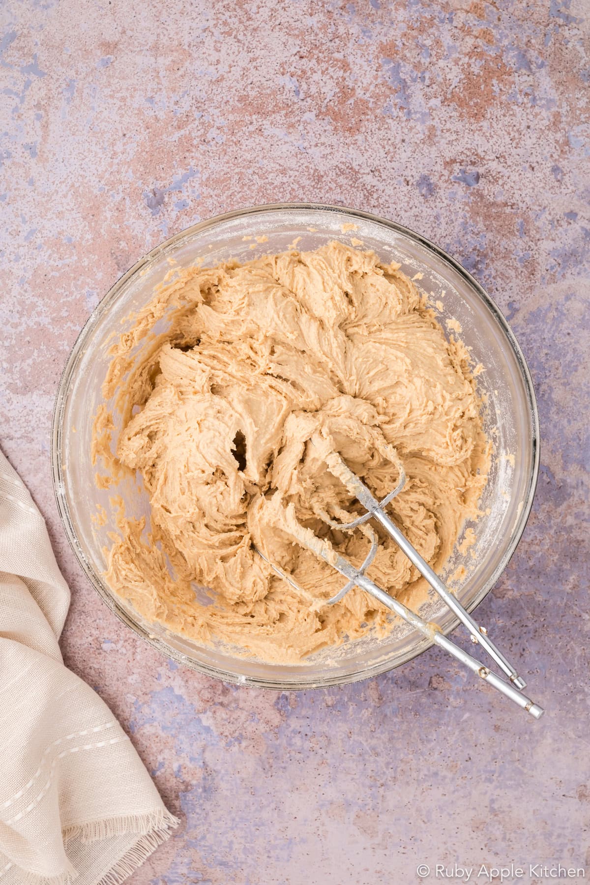Cookie dough in a mixing bowl after the dry ingredients have been incorporated.